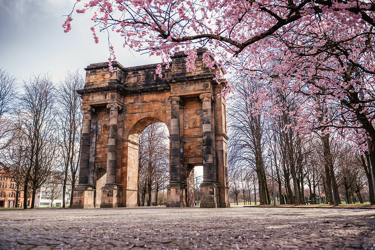McLennan Arch at Glasgow Green framed by cherry blossom in spring